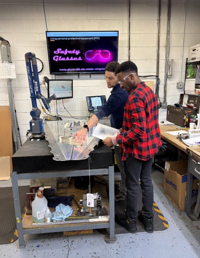 Two students in machine shop