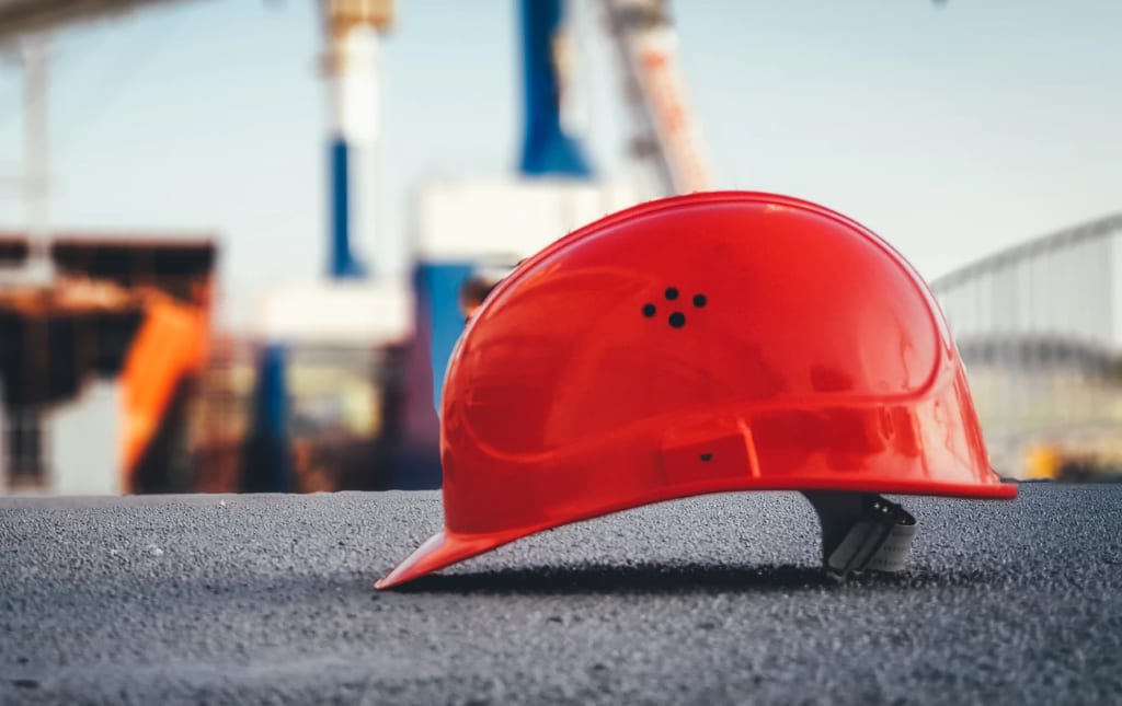 Hard hat, Automotive design, Cap, Helmet, Asphalt, Wood