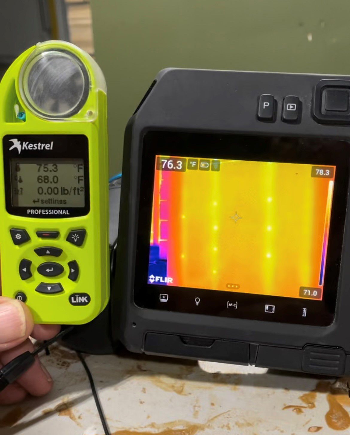 Kestrel meter and FLIR thermal camera displaying temperature readings.