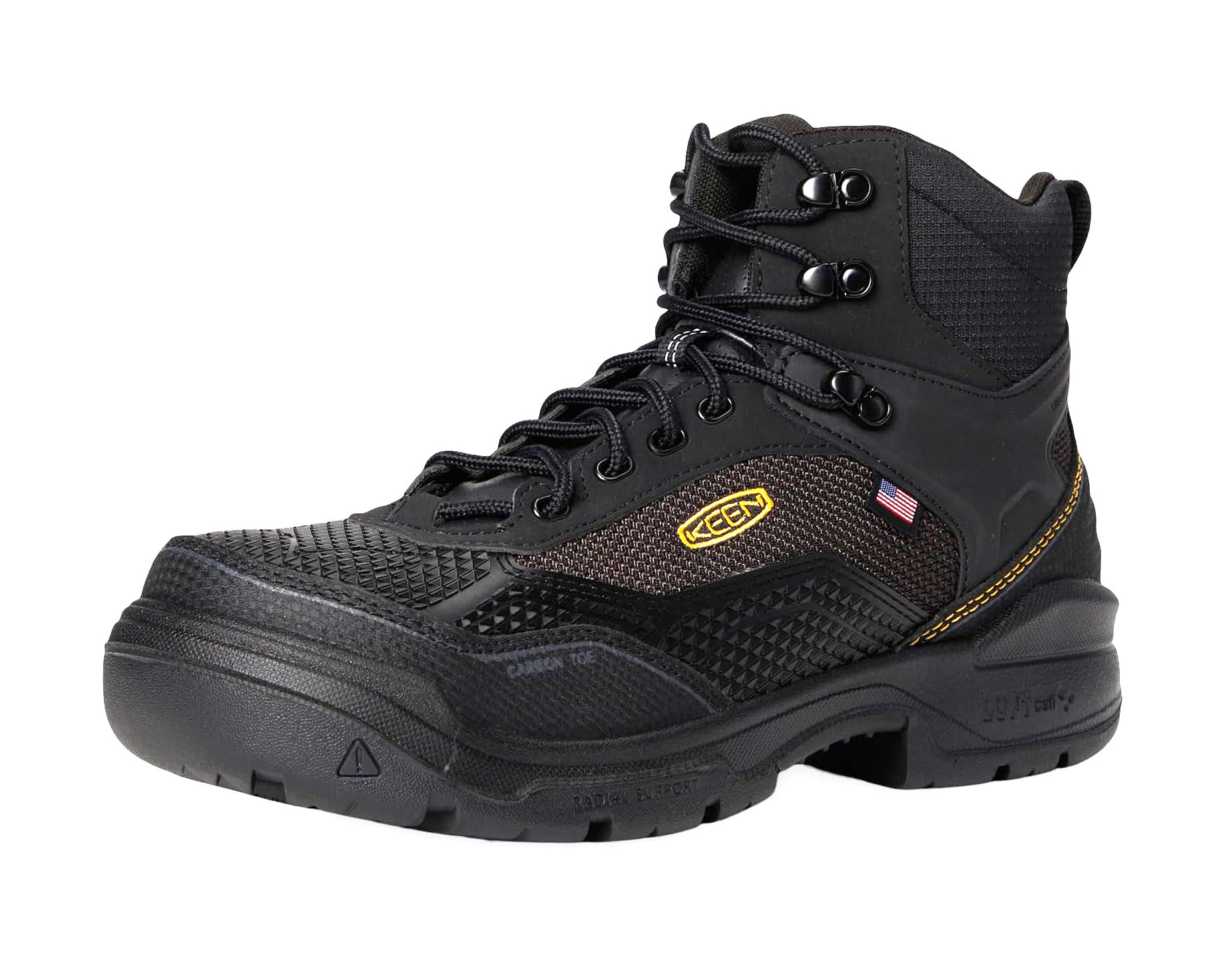 Black Keen work boot with yellow logo, US flag, carbon toe, and radial support.