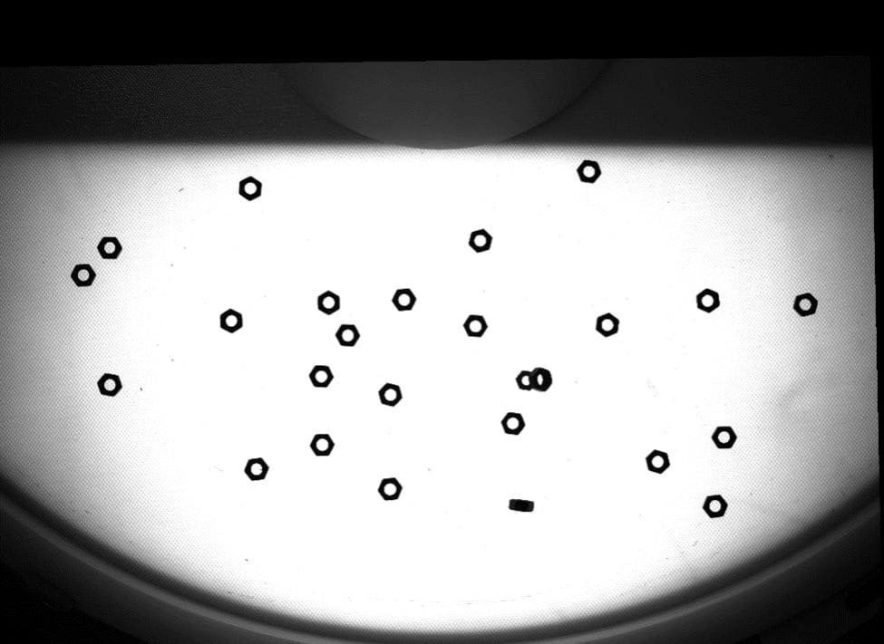 A unique EOAT utilizing a vacuum allows a vision-guided robot (VGR) system to pick up parts that are featureless or too small for traditional grippers. 