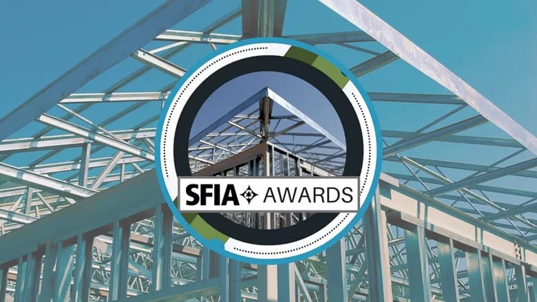 SFIA Awards logo centered on metal building framing against a blue sky.