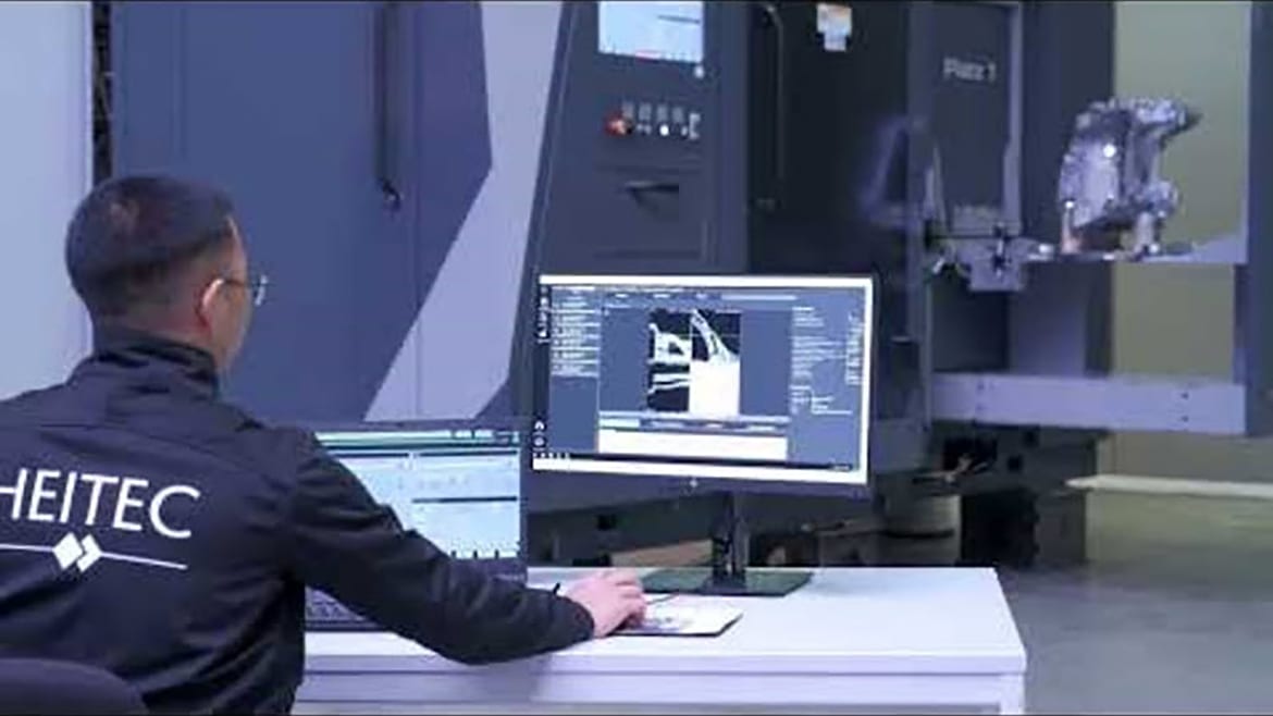 ImageAn engineer monitoring a robotic CT scan and analysis system as it inspects a manufactured component.