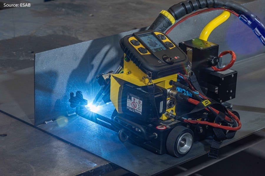 ESAB automated welding machine with bright arc welding metal plates.