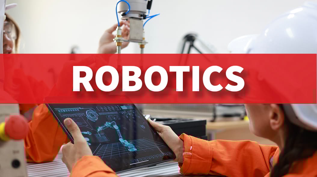 Engineers work on robotics, one using a tablet to control a robotic arm, with 'ROBOTICS' text.
