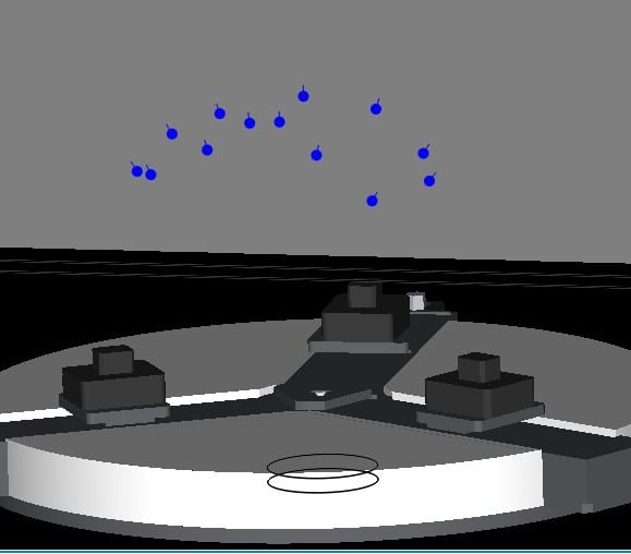 Blue dots float over a grey platform with dark structures and a black ring.