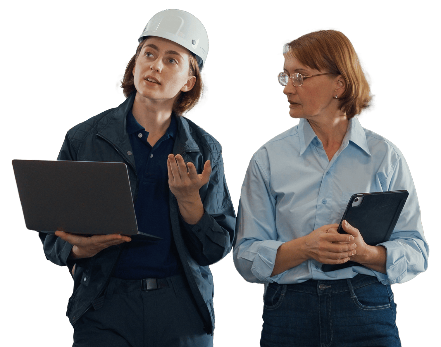 Engineer with laptop and colleague with tablet discussing.