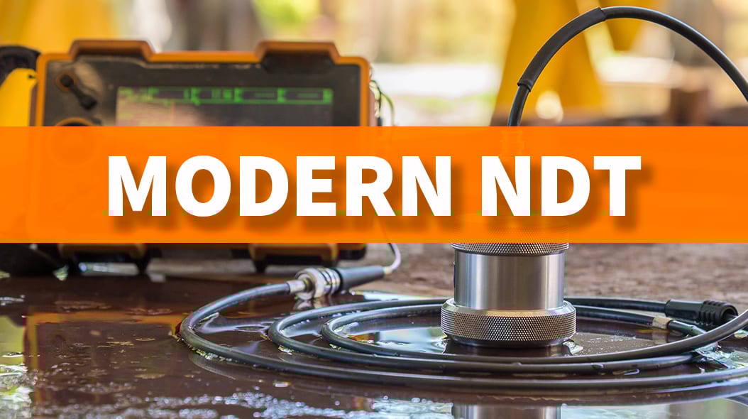 NDT equipment on a wet surface with an orange banner displaying 'MODERN NDT'.