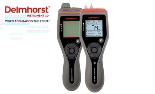 Two Delmhorst moisture meters, one displaying '74', with the company logo and slogan.