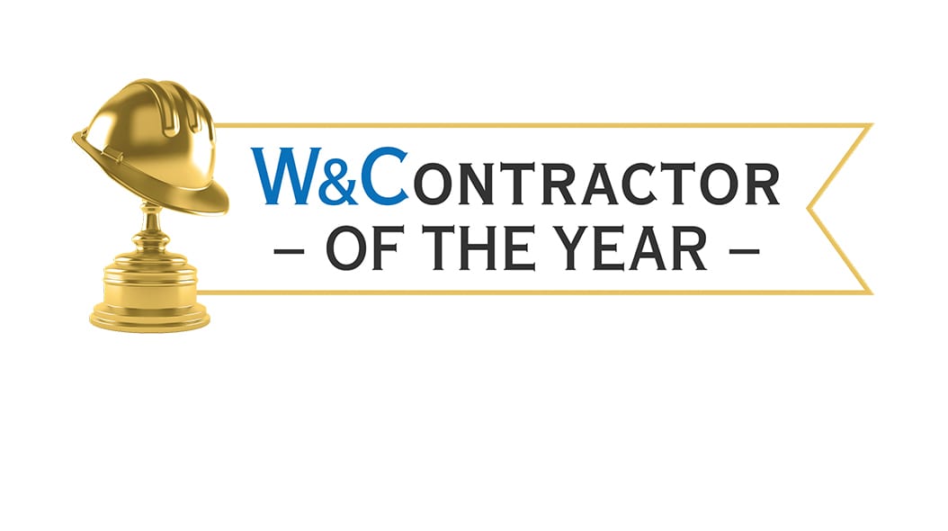 Golden hard hat trophy and "W&C CONTRACTOR OF THE YEAR" banner.