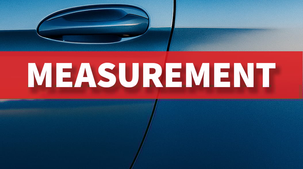 Blue car door handle with "MEASUREMENT" text.