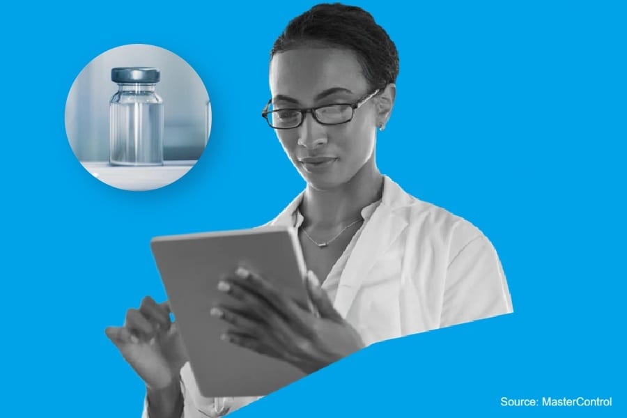 A female scientist in a lab coat looks at a tablet; a medicine vial is shown in a circle. Blue background.