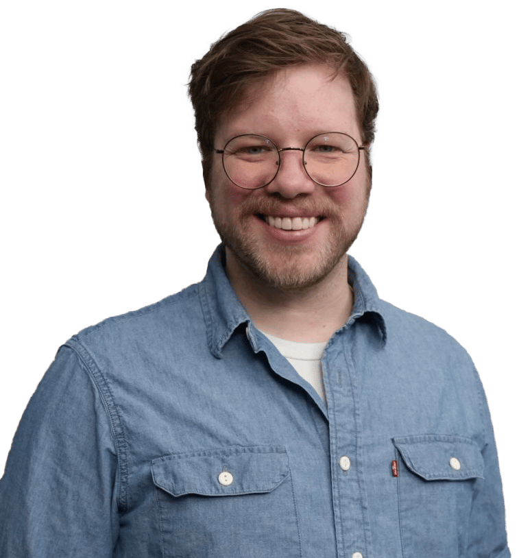 Happy man with glasses and denim shirt.