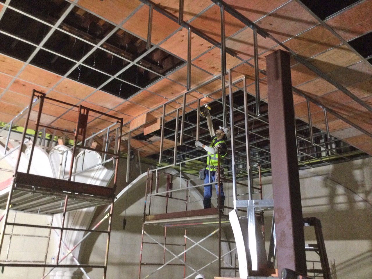 Worker installing ceiling at Lanier Theological Library