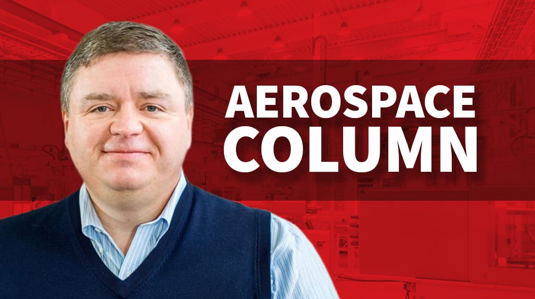 A man smiling in a blue sweater against a red background with white text 'AEROSPACE COLUMN'.