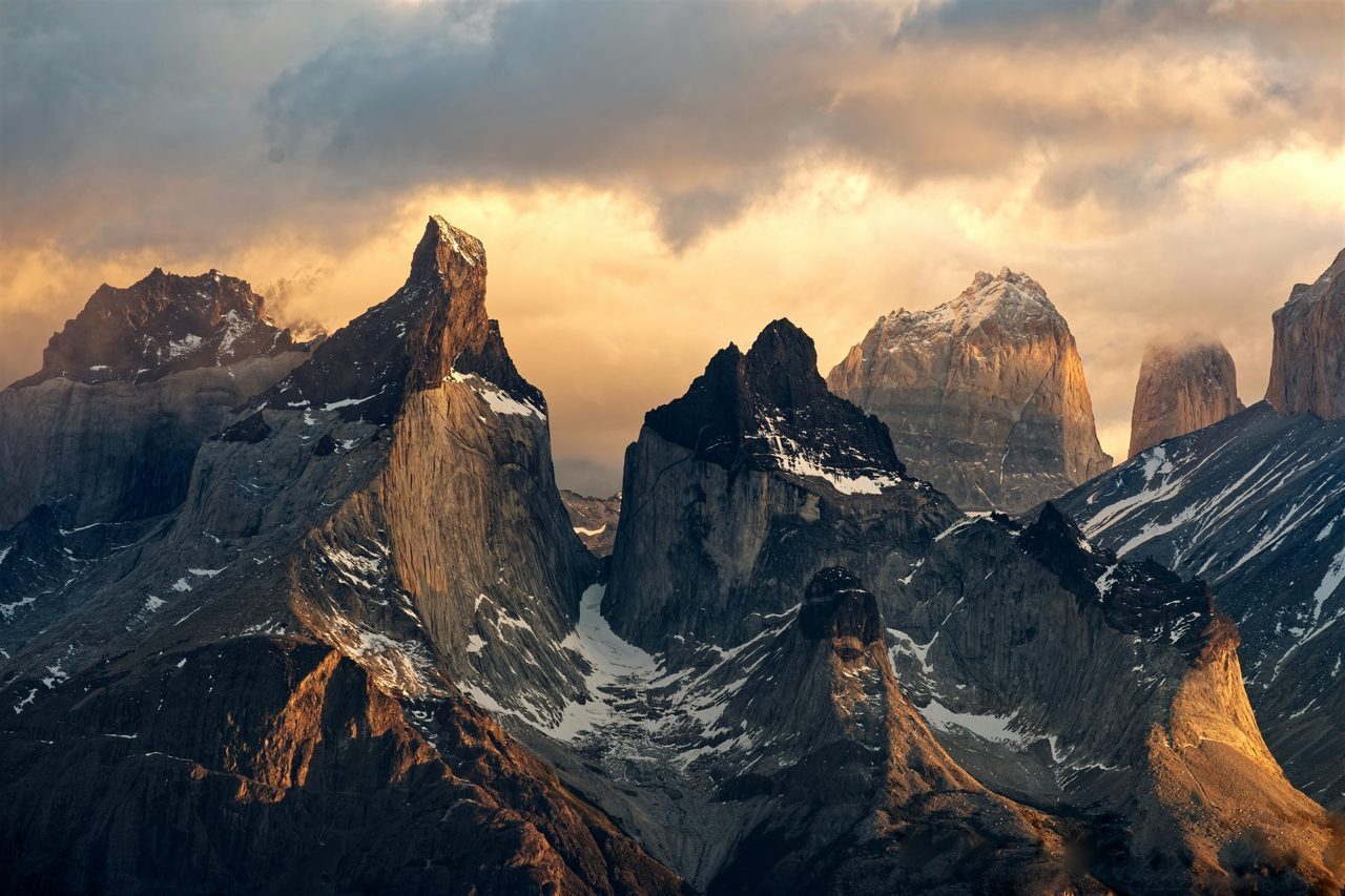 The dramatic peaks of the Torres del Paine National Park in Chile at sunrise.