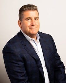 Dress shirt, Smile, Outerwear, Jaw, Sleeve, Gesture, Collar, Suit