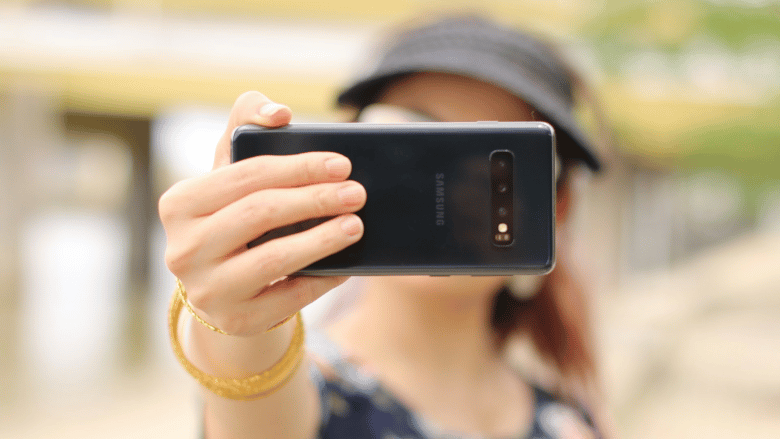 Portable communications device, Mobile phone, Camera lens, Photographer, Telephony, Gadget, Gesture, Thumb, Finger