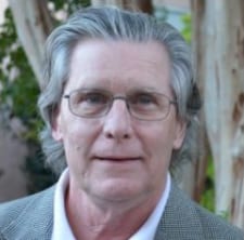 Man with gray hair and glasses.