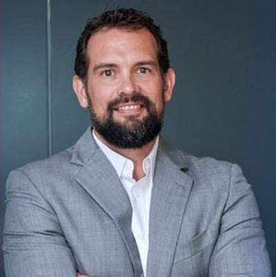 Dress shirt, Forehead, Hair, Smile, Chin, Eyebrow, Beard, Jaw, Sleeve, Gesture