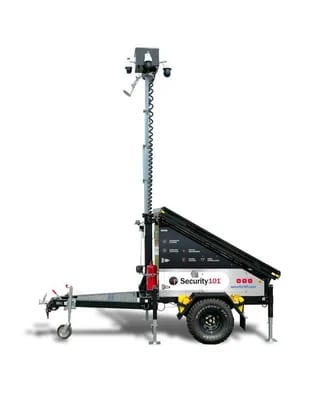 Mobile security surveillance tower with cameras, solar panels, and a trailer.