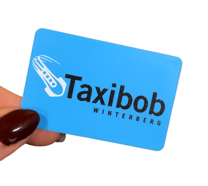 Blue card for "Taxibob WINTERBERG" with a stylized taxi icon, held by a hand.