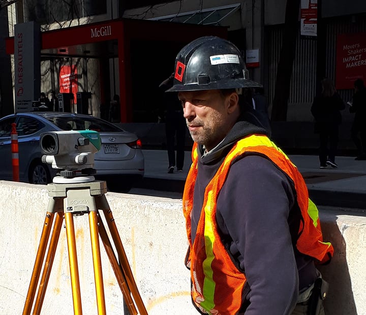 High-visibility clothing, Automotive lighting, Hard hat, Tripod, Car, Workwear, Helmet, Theodolite, Vehicle, Tire