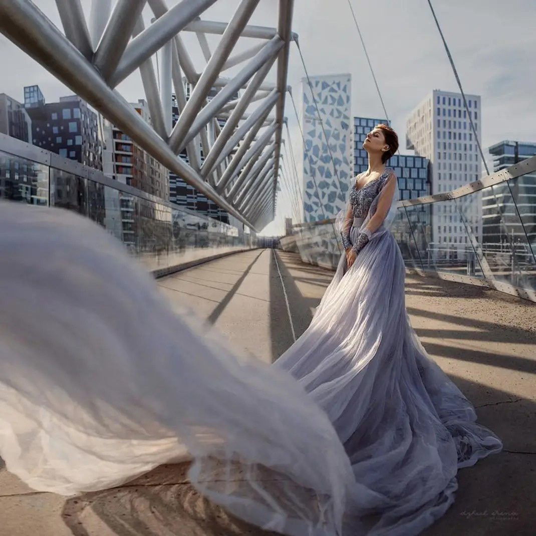 Flash photography, Wedding dress, Sky, Building, Cloud, Gown