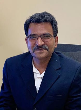 Vision care, Dress shirt, Forehead, Glasses, Chin, Smile, Sleeve, Gesture, Collar, Suit