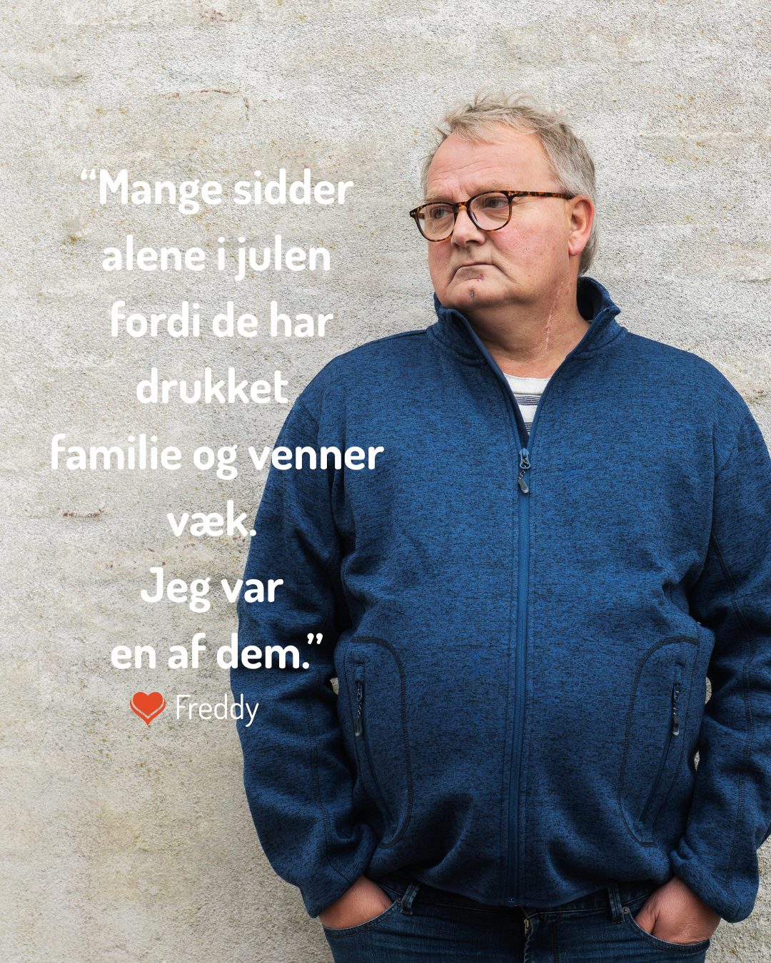 Man, blue jacket, glasses. Quote by Freddy about loneliness at Christmas due to alcohol.