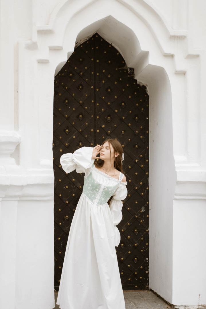 Human body, Flash photography, Outerwear, Hairstyle, Shoulder, Dress, Fashion, Textile, Temple, Standing