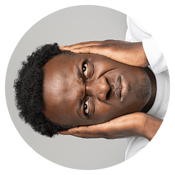 Man covering ears