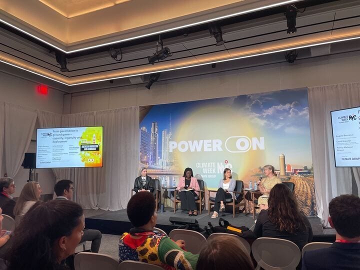 Panel of 4 women at Climate Week NYC, discussing governance to deployment.