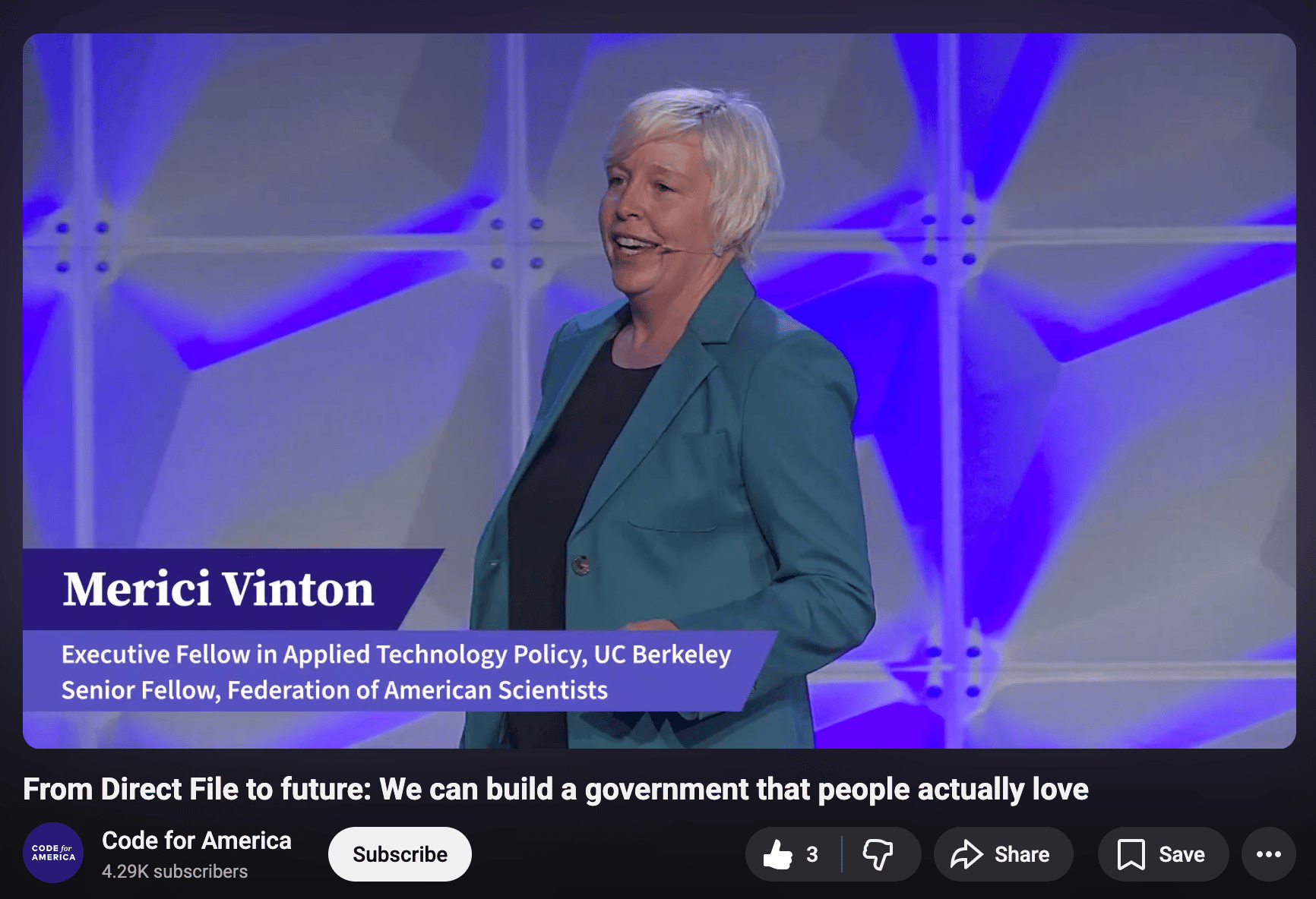 Merici Vinton, Executive Fellow at UC Berkeley, speaking on stage with a blue geometric backdrop.