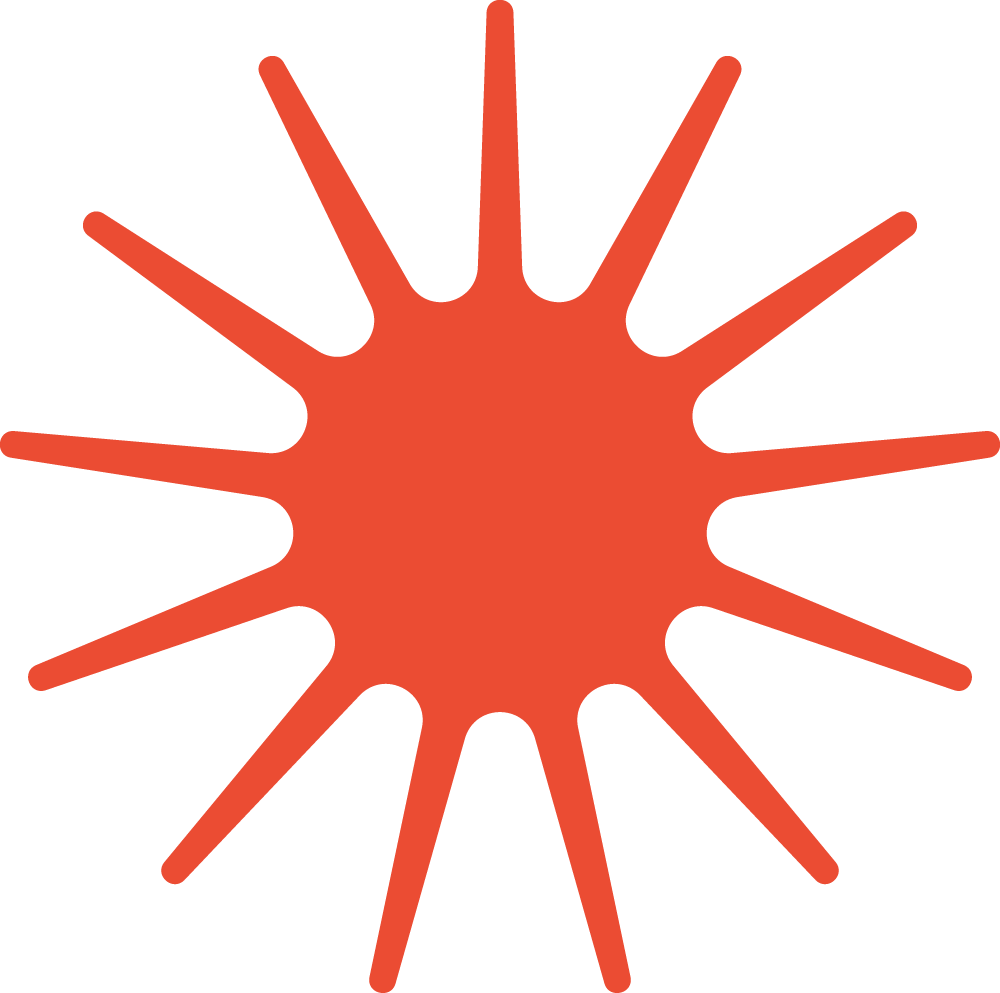 A red irregular starburst shape on a green background.