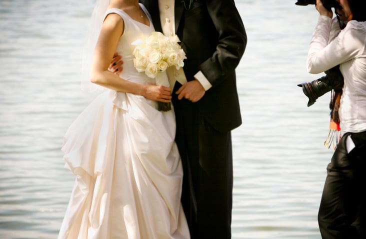 Wedding dress, Bridal clothing, Flash photography, Flower, Water, Bride, Plant, Happy, Standing
