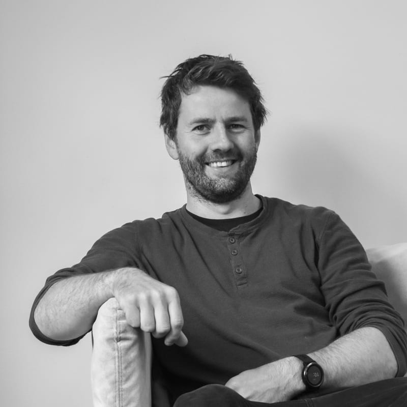 Flash photography, Forehead, Watch, Smile, Arm, Mouth, Beard, Human, Jaw, Sleeve