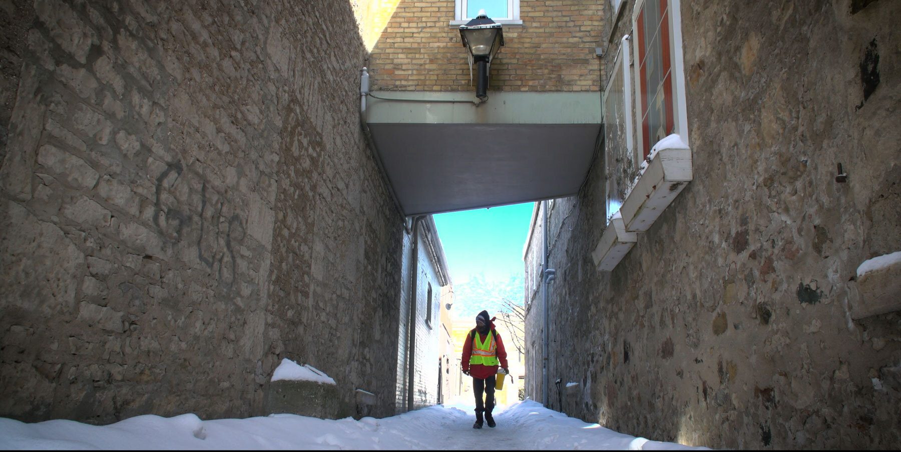image of a person walking down an alley