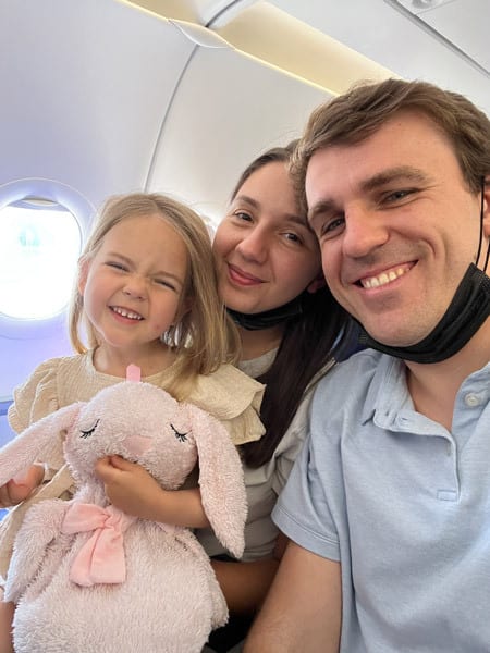 an image of a family on a plane