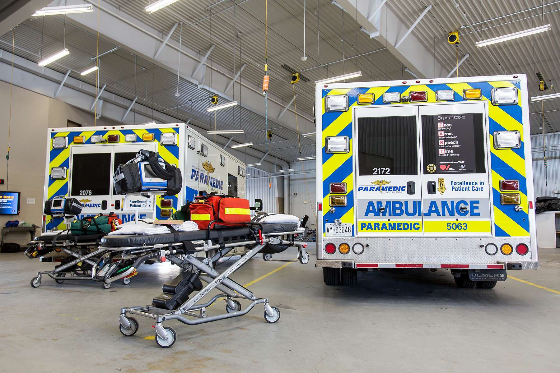 an image of two ambulances and a stretcher