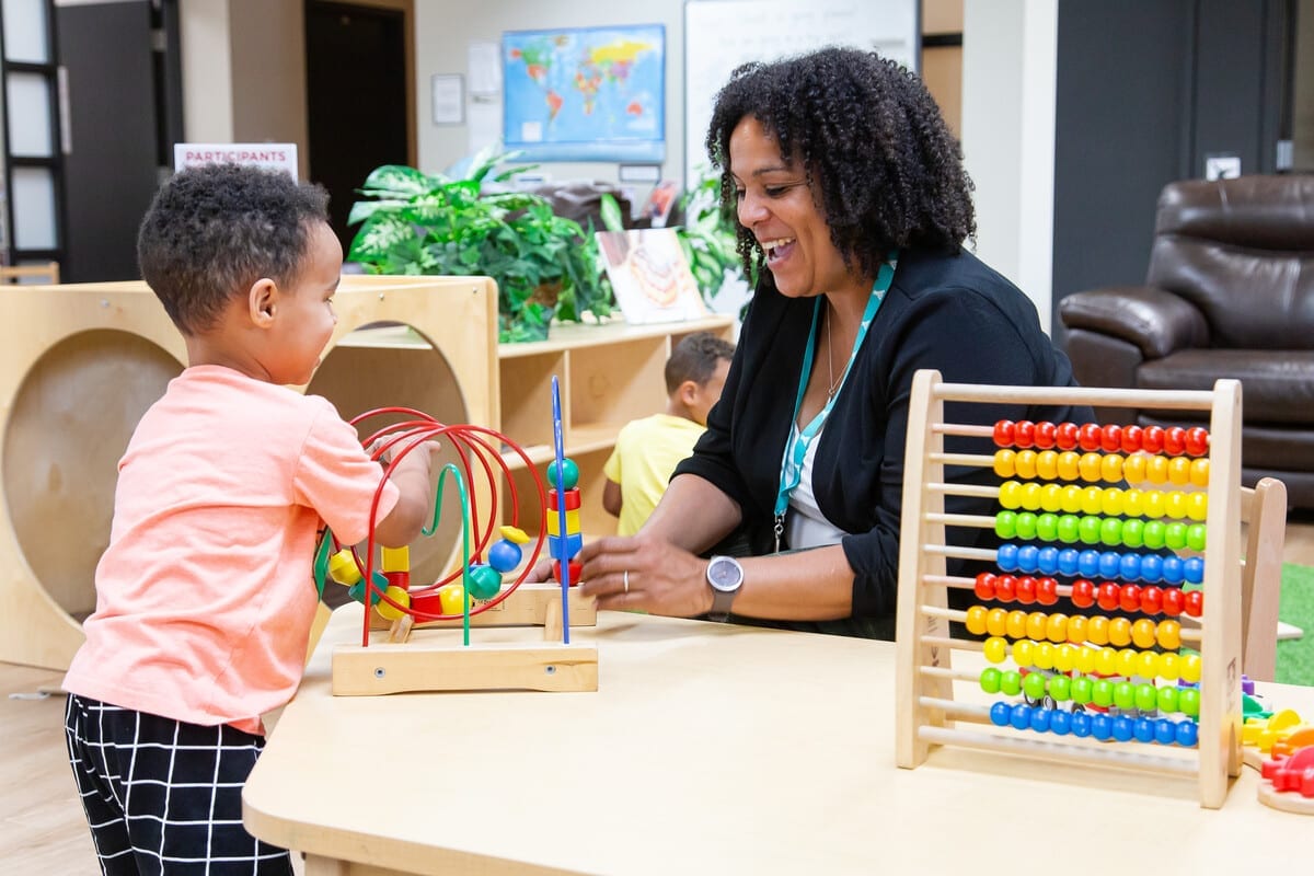 An early childhood educator playing with a child