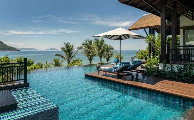 Swimming pool, Outdoor furniture, Water, Sky, Property, Plant, Azure, Cloud, Sunlounger, Umbrella