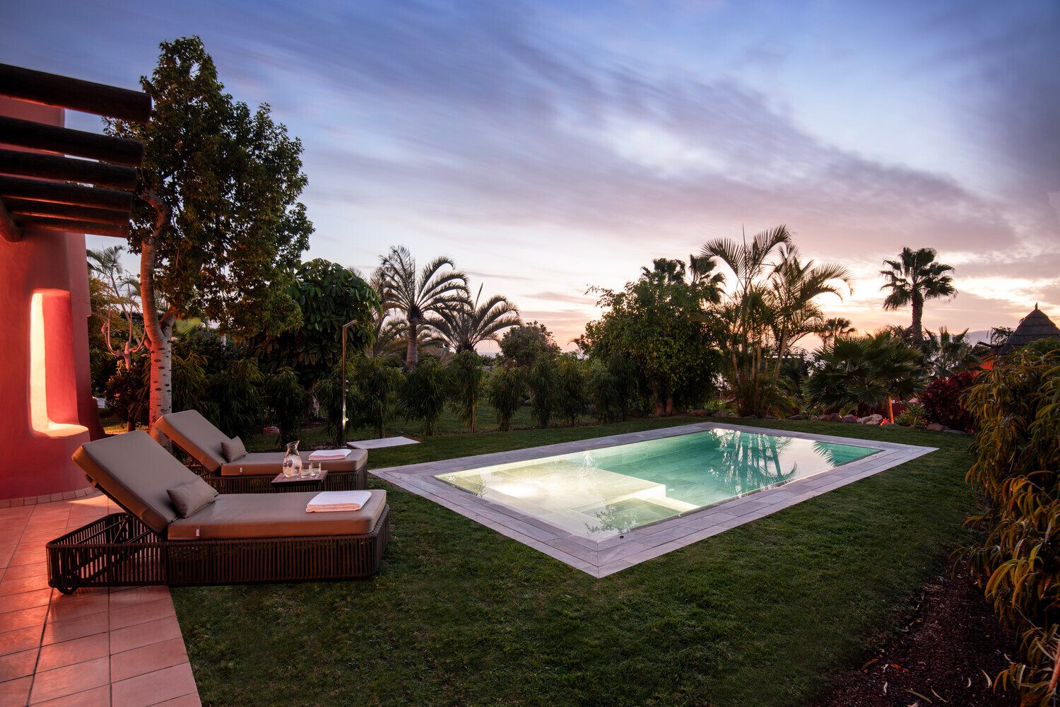 Swimming pool, Outdoor furniture, Water, Sky, Cloud, Plant, Tree, Grass, Leisure, Arecales