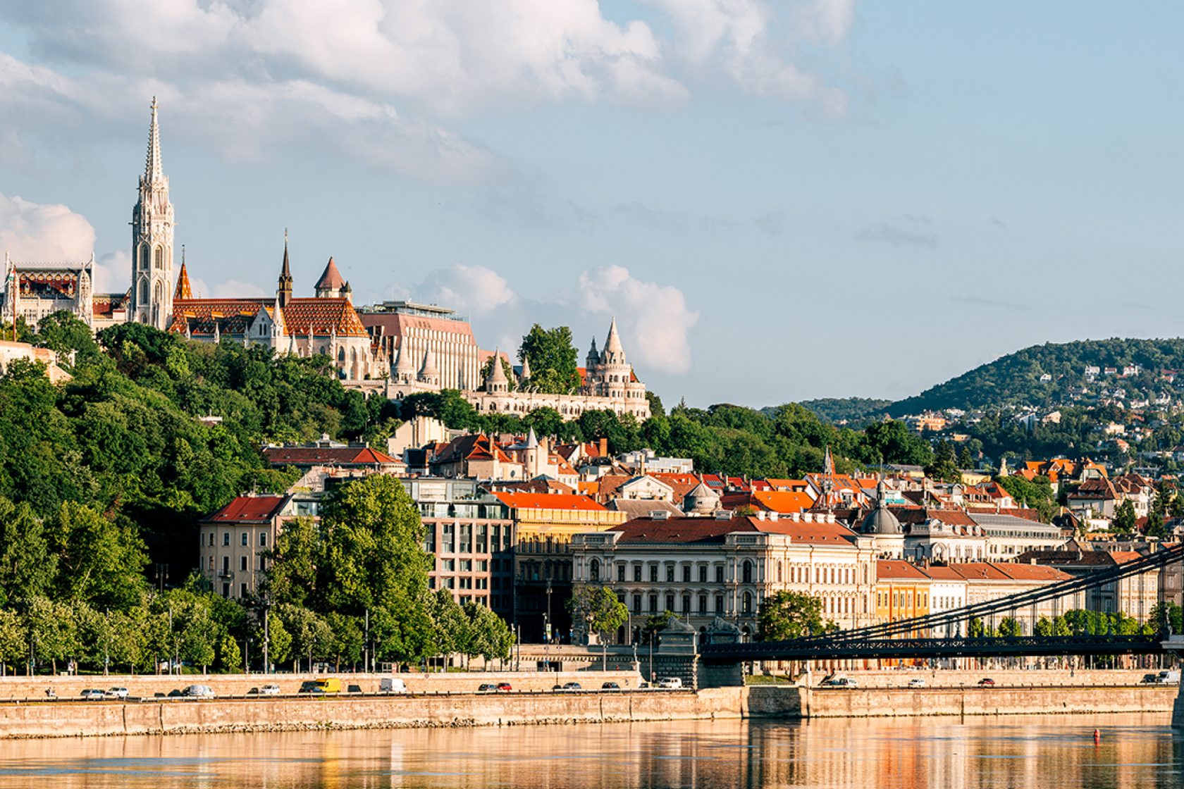 Budapest cityscape: Matthias Church and Fisherman's Bastion on Buda Hill overlooking the Danube River.