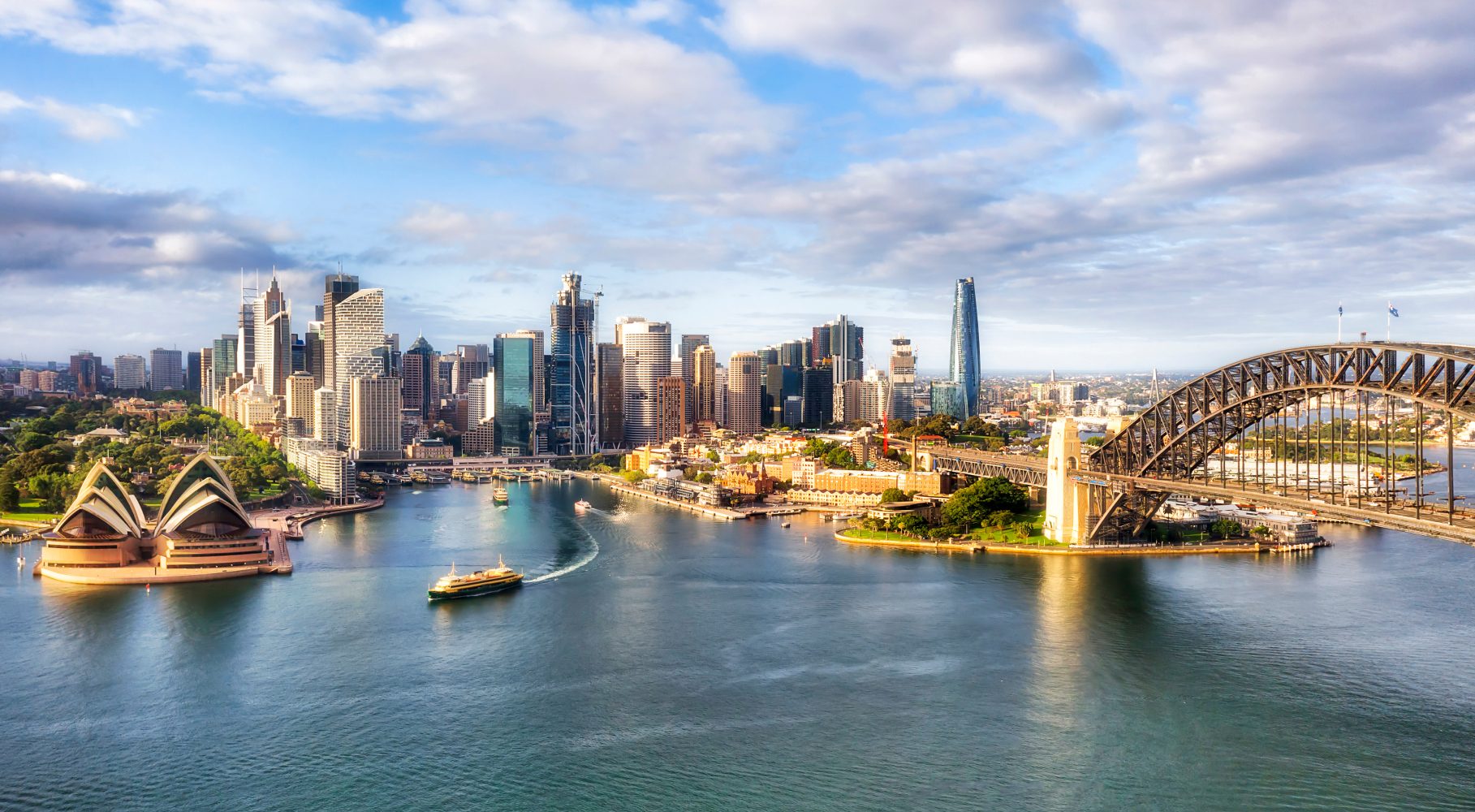 Sydney Harbour: Opera House, Harbour Bridge, and city skyline.