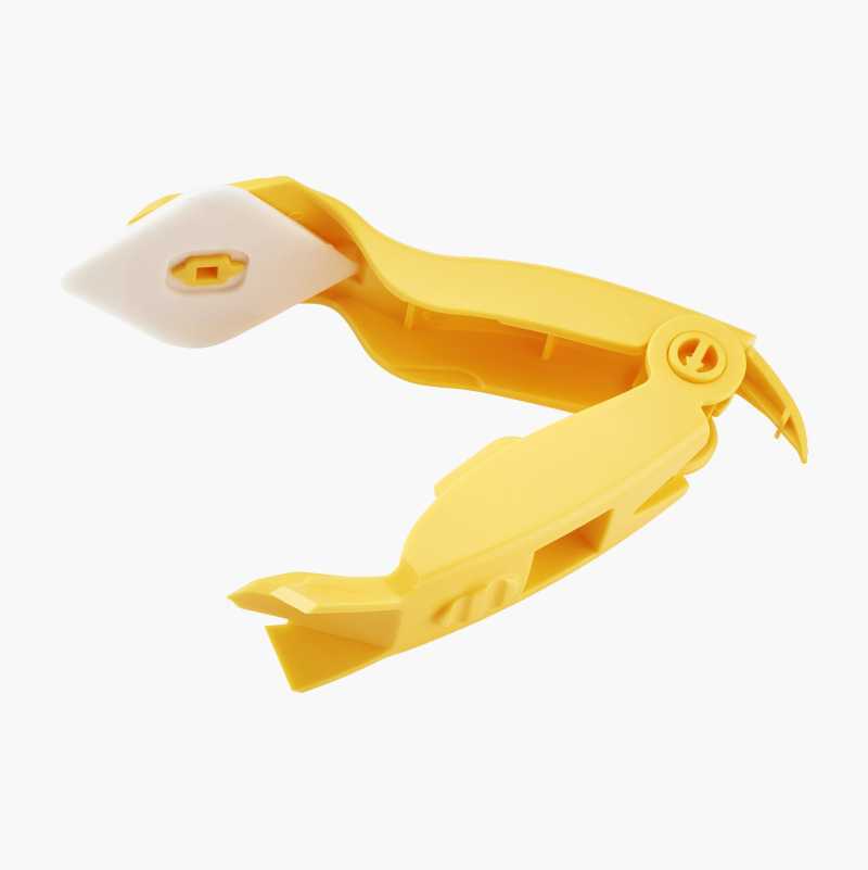 Yellow caulking tool with white tip and scraper.