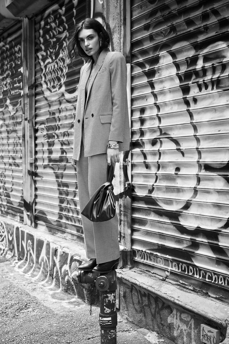 White, Black, Textile, Standing, Black-and-white, Eyewear, Grey, Style, Headgear, Hat