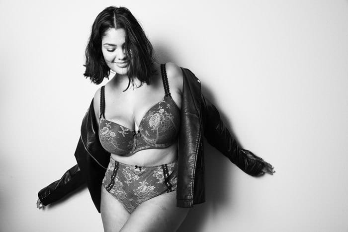 Flash photography, Lingerie top, Hair, Arm, Smile, Waist, Gesture, Thigh, Latex, Style