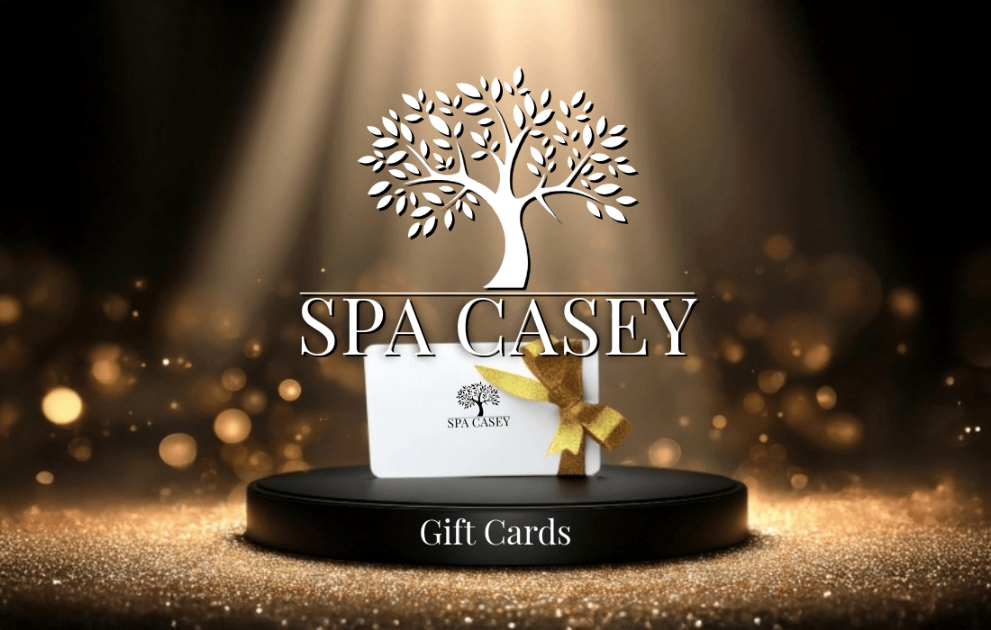 SPA CASEY logo, gift card on pedestal, and "Gift Cards" text on a golden, sparkling background.