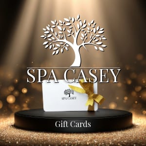 Spa Casey logo above a gift card on a pedestal, with "Gift Cards" text.